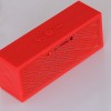 red wireless bluetooth speaker with logo